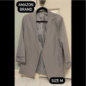 Grey mid forearm length jacket (no buttons). Amazon brand size medium